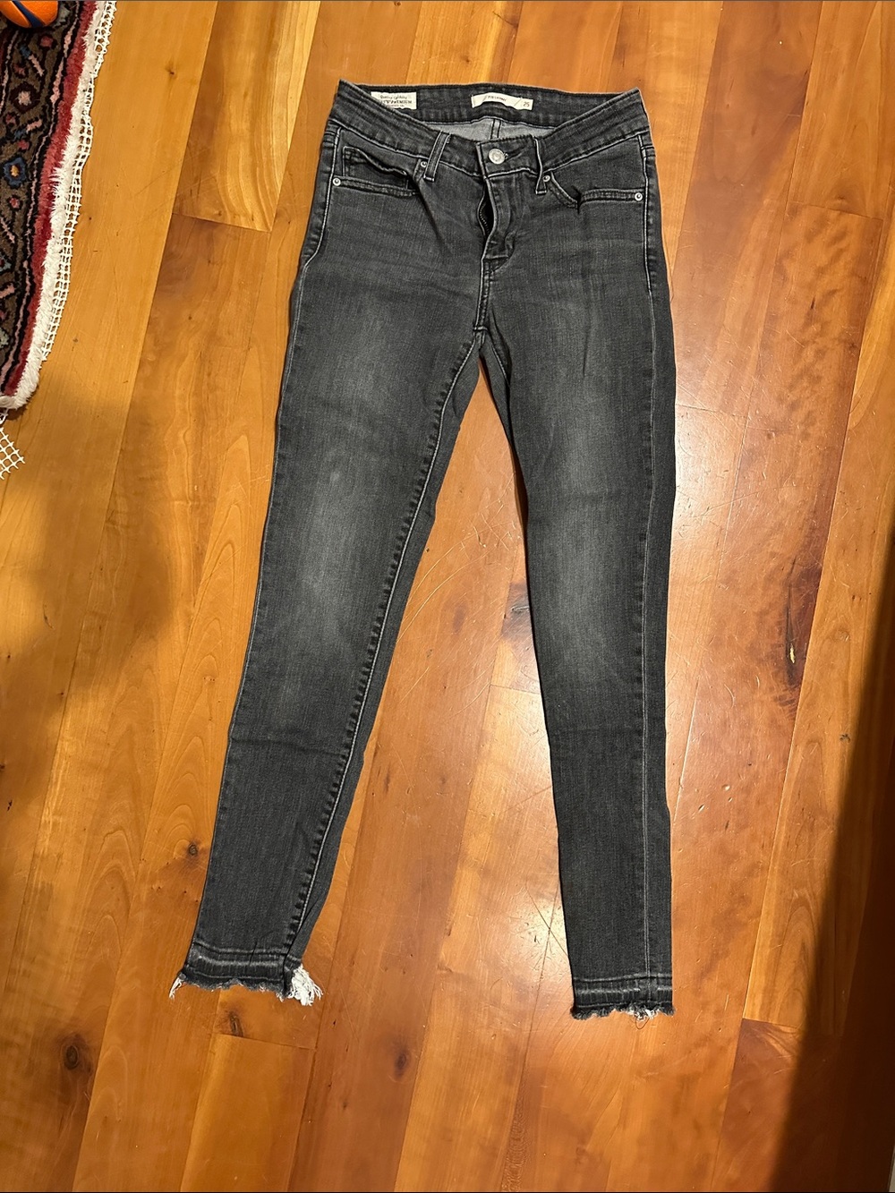 Levi's Women's Black Washed Skinny Jeans with Raw Hem
